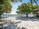 Sandy beach with volleyball court and lake access at 10603 Coquita Ln, Tampa, FL 33618