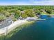 Aerial view of lakefront community with beach and pier at 10603 Coquita Ln, Tampa, FL 33618
