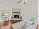 Cozy living room with stone fireplace and shiplap wall at 10603 Coquita Ln, Tampa, FL 33618