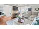Spacious living room with L-shaped sofa and fireplace at 10603 Coquita Ln, Tampa, FL 33618