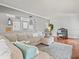 Living room with sectional sofa and gallery wall at 10603 Coquita Ln, Tampa, FL 33618