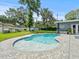 Relaxing kidney shaped pool with a spacious patio at 10603 Coquita Ln, Tampa, FL 33618