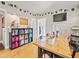 Study with built-in bookcases, a long table, and hardwood floors at 10603 Coquita Ln, Tampa, FL 33618