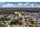 Aerial view of a house and neighborhood, showcasing surrounding homes and landscape at 11607 Branch Mooring Dr, Tampa, FL 33635