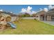 Spacious backyard with playset and grassy area at 11607 Branch Mooring Dr, Tampa, FL 33635