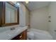 Updated bathroom with tub, new vanity, and mirror at 11607 Branch Mooring Dr, Tampa, FL 33635