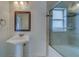 Bathroom with tub, shower, and pedestal sink at 11607 Branch Mooring Dr, Tampa, FL 33635