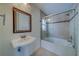 Bathroom with tub, shower, and pedestal sink at 11607 Branch Mooring Dr, Tampa, FL 33635