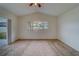 Spacious bedroom with carpet, vaulted ceiling, and sliding glass door at 11607 Branch Mooring Dr, Tampa, FL 33635