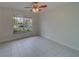 Spacious bedroom with tile floors and ceiling fan at 11607 Branch Mooring Dr, Tampa, FL 33635