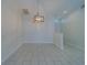 Dining room with tile floors and modern light fixture at 11607 Branch Mooring Dr, Tampa, FL 33635