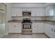 Kitchen boasts granite countertops and stainless steel appliances at 11607 Branch Mooring Dr, Tampa, FL 33635