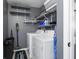 Laundry room with washer, dryer, and storage shelves at 12317 Cedarfield Dr, Riverview, FL 33579