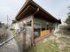 House with damaged sunroom and chain link fence at 12812 1St Isle, Hudson, FL 34667