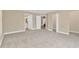 Large bedroom with carpet, an ensuite bathroom, and ample closet space at 12918 Cambridge Ave, Tampa, FL 33624
