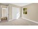 Well-lit bedroom with plush carpeting and a closet at 12918 Cambridge Ave, Tampa, FL 33624