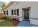 Updated home exterior with fresh landscaping and a modern front door at 12918 Cambridge Ave, Tampa, FL 33624