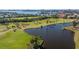 Aerial view of community with golf course and water features at 1322 Pelican Creek Xing # C, St Petersburg, FL 33707