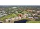 Aerial view showcasing condo community by golf course and lake at 1322 Pelican Creek Xing # C, St Petersburg, FL 33707