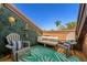 Private balcony with seating area and lush green wall at 1322 Pelican Creek Xing # C, St Petersburg, FL 33707