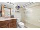 Bathroom with walk-in shower and updated vanity at 1322 Pelican Creek Xing # C, St Petersburg, FL 33707
