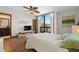 Bright bedroom with wood floors and access to balcony at 1322 Pelican Creek Xing # C, St Petersburg, FL 33707