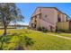 Condo exterior showcasing landscaping and golf course views at 1322 Pelican Creek Xing # C, St Petersburg, FL 33707