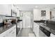 Modern kitchen with stainless steel appliances and granite countertops at 1322 Pelican Creek Xing # C, St Petersburg, FL 33707