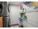 Laundry room with washer, dryer and storage shelves at 1322 Pelican Creek Xing # C, St Petersburg, FL 33707