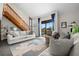 Spacious living room with a loft, wood stairs, and neutral decor at 1322 Pelican Creek Xing # C, St Petersburg, FL 33707