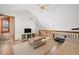 Open loft space, featuring a TV, couch, and access to bathroom at 1322 Pelican Creek Xing # C, St Petersburg, FL 33707