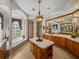Elegant bathroom featuring a large vanity and soaking tub at 13315 Carnoustie Cir, Dade City, FL 33525