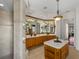 Bathroom with double vanities and a large soaking tub at 13315 Carnoustie Cir, Dade City, FL 33525