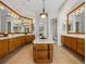 Primary bathroom with double vanities and a large shower at 13315 Carnoustie Cir, Dade City, FL 33525