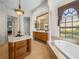 Luxurious bathroom with a large soaking tub and separate shower at 13315 Carnoustie Cir, Dade City, FL 33525