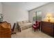 Bedroom with daybed, antique desk and chair at 13315 Carnoustie Cir, Dade City, FL 33525