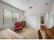 Bright bedroom with window seating, carpet, and large closet at 13315 Carnoustie Cir, Dade City, FL 33525