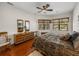 Spacious bedroom with wood floors and large windows at 13315 Carnoustie Cir, Dade City, FL 33525