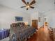 Spacious bedroom with king-size bed and ensuite bathroom access at 13315 Carnoustie Cir, Dade City, FL 33525