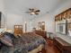 Comfortable bedroom with king-size bed and hardwood floors at 13315 Carnoustie Cir, Dade City, FL 33525