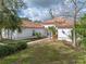 Landscaped front yard with walkway to entryway at 13315 Carnoustie Cir, Dade City, FL 33525