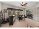 Relaxing game room with wet bar, patio access, and seating area at 13315 Carnoustie Cir, Dade City, FL 33525