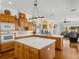Open concept kitchen boasting an island and modern appliances at 13315 Carnoustie Cir, Dade City, FL 33525