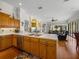 Open kitchen with island, stainless steel appliances, and breakfast bar at 13315 Carnoustie Cir, Dade City, FL 33525