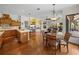 Eat-in kitchen with wood cabinets, island, and breakfast nook at 13315 Carnoustie Cir, Dade City, FL 33525