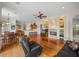Open concept living area with hardwood floors, fireplace and kitchen at 13315 Carnoustie Cir, Dade City, FL 33525