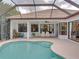 Relaxing pool and patio area with seating for entertaining at 13315 Carnoustie Cir, Dade City, FL 33525