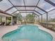 Resort-style screened pool and spa at 13315 Carnoustie Cir, Dade City, FL 33525