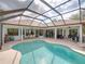 Relaxing pool and spa with screened enclosure at 13315 Carnoustie Cir, Dade City, FL 33525