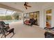 Outdoor living space with seating and pool view at 13315 Carnoustie Cir, Dade City, FL 33525